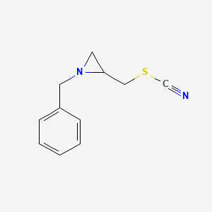 Thiocyanic acid, [1-(phenylmethyl)-2-aziridinyl]methyl ester