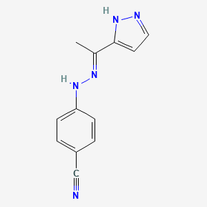 4-[(2E)-2-[1-(1H-pyrazol-5-yl)ethylidene]hydrazinyl]benzonitrile