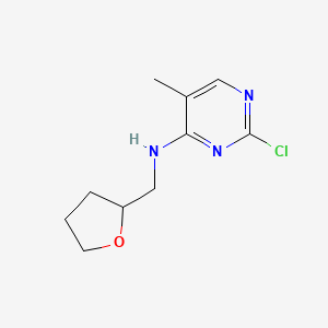 2-Chloro-5-methyl-N-[(oxolan-2-yl)methyl]pyrimidin-4-amine