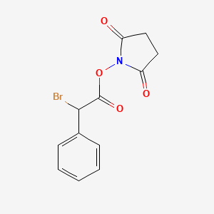 molecular formula C12H10BrNO4 B14242638 1-{[Bromo(phenyl)acetyl]oxy}pyrrolidine-2,5-dione CAS No. 594857-18-8