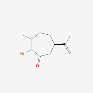 (6R)-2-Bromo-3-methyl-6-(prop-1-en-2-yl)cyclohept-2-en-1-one