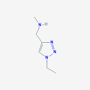 molecular formula C6H12N4 B1425709 [(1-Ethyl-1H-1,2,3-triazol-4-yl)methyl](methyl)amine CAS No. 1496727-14-0