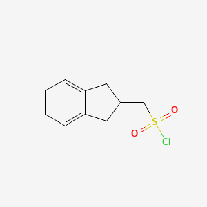 molecular formula C10H11ClO2S B1425871 (2,3-dihydro-1H-inden-2-yl)methanesulfonyl chloride CAS No. 348080-86-4