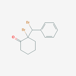 2-Bromo-2-[bromo(phenyl)methyl]cyclohexan-1-one