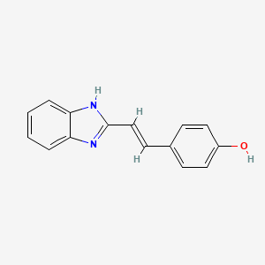 molecular formula C15H12N2O B14292330 4-[(E)-2-(1H-benzimidazol-2-yl)ethenyl]phenol 