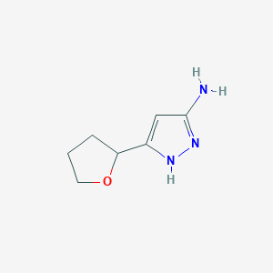 molecular formula C7H11N3O B1429363 5-(Tetrahydrofuran-2-yl)-2H-pyrazol-3-ylamine CAS No. 1028843-21-1