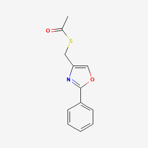 molecular formula C12H11NO2S B1430688 1-{[(2-苯基-1,3-恶唑-4-基)甲基]硫烷基}乙烷-1-酮 CAS No. 126271-50-9