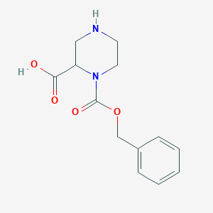 B143169 1-((Benzyloxy)carbonyl)piperazine-2-carboxylic acid CAS No. 129365-24-8