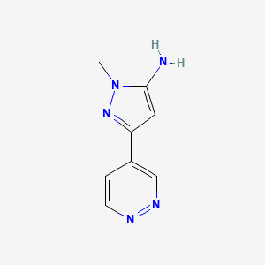 molecular formula C8H9N5 B1433973 1-methyl-3-(pyridazin-4-yl)-1H-pyrazol-5-amine CAS No. 1564818-41-2