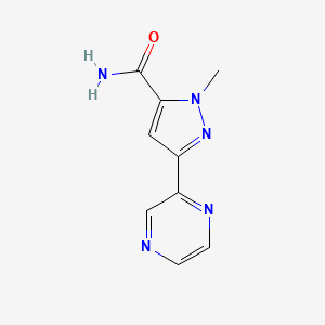molecular formula C9H9N5O B1435225 1-甲基-3-(吡嗪-2-基)-1H-吡唑-5-甲酰胺 CAS No. 2095410-85-6