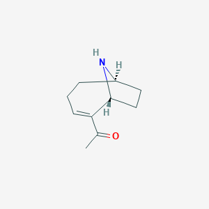 molecular formula C₁₀H₁₅NO B143684 1-[(1r,6r)-9-氮杂双环[4.2.1]壬-2-烯-2-基]乙酮 CAS No. 64285-06-9