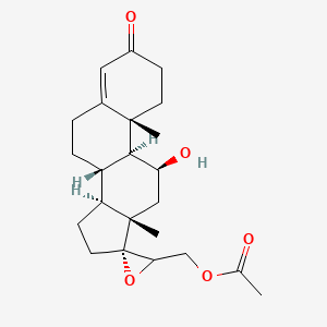 molecular formula C23H32O5 B14443776 [(8S,9S,10R,11S,13S,14S,17R)-11-hydroxy-10,13-dimethyl-3-oxospiro[2,6,7,8,9,11,12,14,15,16-decahydro-1H-cyclopenta[a]phenanthrene-17,3'-oxirane]-2'-yl]methyl acetate CAS No. 74373-63-0