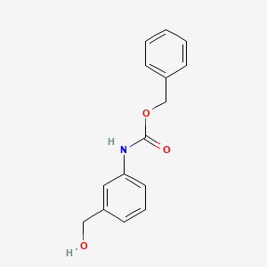 molecular formula C15H15NO3 B1444876 3-(Cbz-Amino)benzyl alcohol CAS No. 135429-73-1