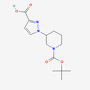 B1446958 1-{1-[(tert-butoxy)carbonyl]piperidin-3-yl}-1H-pyrazole-3-carboxylic acid CAS No. 1803561-36-5