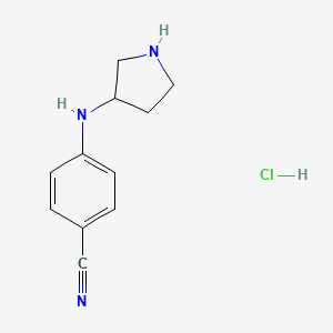 B1447130 4-[(Pyrrolidin-3-yl)amino]benzonitrile hydrochloride CAS No. 1803610-65-2