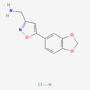 molecular formula C11H11ClN2O3 B1448160 {[5-(1,3-Benzodioxol-5-yl)isoxazol-3-yl]methyl}amine hydrochloride CAS No. 1351648-34-4