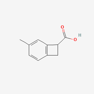 molecular formula C10H10O2 B1448607 4-甲基双环[4.2.0]辛-1,3,5-三烯-7-羧酸 CAS No. 1781334-49-3