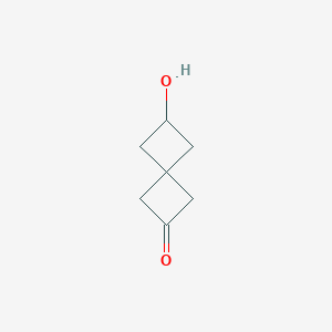 molecular formula C7H10O2 B1448893 6-羟基螺[3.3]庚烷-2-酮 CAS No. 1952348-83-2