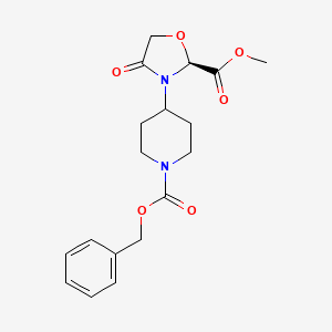 B1449322 Methyl (2S)-3-{1-[(benzyloxy)carbonyl]piperidin-4-yl}-4-oxo-1,3-oxazolidine-2-carboxylate CAS No. 1706436-07-8