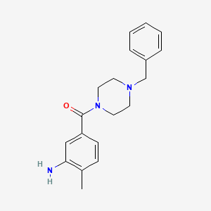 molecular formula C19H23N3O B1451700 5-[(4-苄基哌嗪-1-基)羰基]-2-甲基苯胺 CAS No. 1018563-38-6