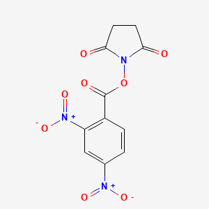 molecular formula C11H7N3O8 B14517494 1-[(2,4-Dinitrobenzoyl)oxy]pyrrolidine-2,5-dione CAS No. 62572-85-4