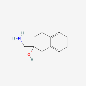 molecular formula C11H15NO B1453572 2-(Aminomethyl)-1,2,3,4-tetrahydronaphthalen-2-ol CAS No. 1179255-66-3