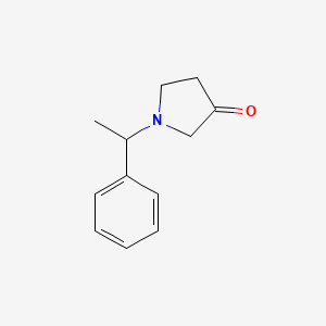 molecular formula C12H15NO B1454031 1-(1-Phenylethyl)pyrrolidin-3-one CAS No. 1086384-99-7