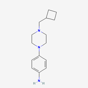 molecular formula C15H23N3 B1454568 4-[4-(Cyclobutylmethyl)piperazin-1-yl]aniline CAS No. 1443980-04-8