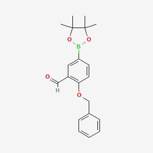 molecular formula C20H23BO4 B1455195 2-苄氧基-5-(4,4,5,5-四甲基-[1,3,2]二氧杂硼烷-2-基)-苯甲醛 CAS No. 2096339-03-4