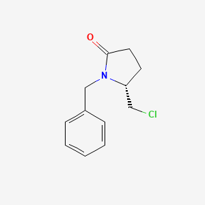 molecular formula C12H14ClNO B1456793 (R)-1-Benzyl-5-chloromethyl-2-pyrrolidinone CAS No. 1272755-28-8