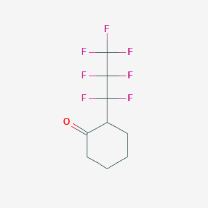 2-(Heptafluoropropyl)cyclohexan-1-one