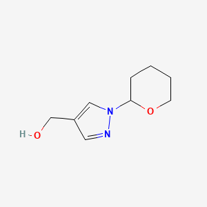 molecular formula C9H14N2O2 B1457195 (1-(tetrahydro-2H-pyran-2-yl)-1H-pyrazol-4-yl)methanol CAS No. 1038392-13-0
