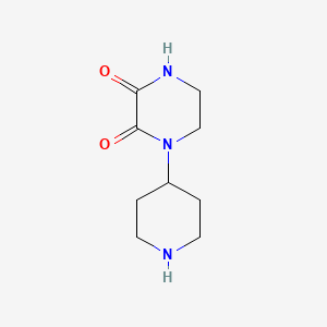 molecular formula C9H15N3O2 B1457701 1-(哌啶-4-基)哌嗪-2,3-二酮 CAS No. 1446407-30-2