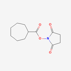 1-[(Cycloheptanecarbonyl)oxy]pyrrolidine-2,5-dione