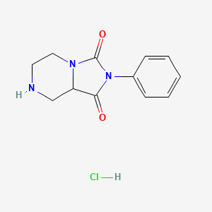 B1458309 2-Phenyl-octahydroimidazolidino[1,5-a]piperazine-1,3-dione hydrochloride CAS No. 1461704-84-6