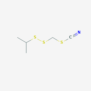 molecular formula C5H9NS3 B14589562 [(Propan-2-yl)disulfanyl]methyl thiocyanate CAS No. 61079-32-1