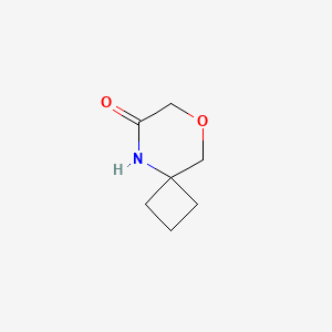 molecular formula C7H11NO2 B1458977 8-Oxa-5-azaspiro[3.5]nonan-6-one CAS No. 1785379-16-9