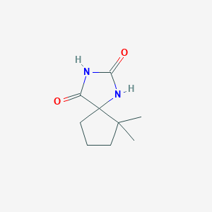 molecular formula C9H14N2O2 B1459105 6,6-二甲基-1,3-二氮杂螺[4.4]壬烷-2,4-二酮 CAS No. 90565-74-5