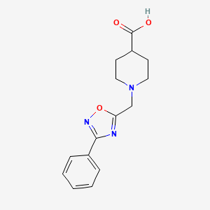 molecular formula C15H17N3O3 B1462784 1-[(3-Phenyl-1,2,4-oxadiazol-5-yl)methyl]piperidine-4-carboxylic acid CAS No. 1153238-95-9