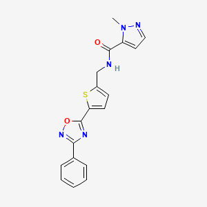 molecular formula C18H15N5O2S B1463807 1-methyl-N-{[5-(3-phenyl-1,2,4-oxadiazol-5-yl)-2-thienyl]methyl}-1H-pyrazole-5-carboxamide CAS No. 1358110-95-8