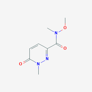 molecular formula C8H11N3O3 B1464117 N-methoxy-N,1-dimethyl-6-oxo-1,6-dihydropyridazine-3-carboxamide CAS No. 1343162-75-3