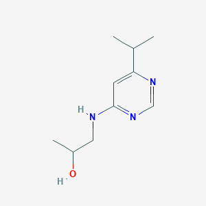 molecular formula C10H17N3O B1464339 1-{[6-(Propan-2-yl)pyrimidin-4-yl]amino}propan-2-ol CAS No. 1247165-43-0