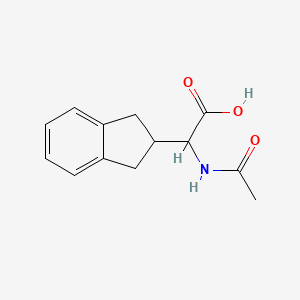 molecular formula C13H15NO3 B1464734 2-(2,3-二氢-1H-茚-2-基)-2-乙酰氨基乙酸 CAS No. 179186-26-6