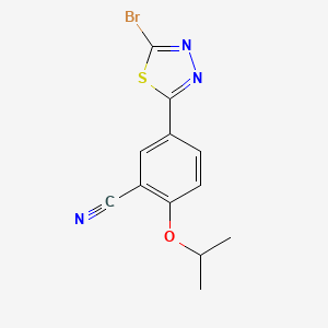 molecular formula C12H10BrN3OS B1466130 5-(5-Bromo-1,3,4-thiadiazol-2-yl)-2-[(1-methylethyl)oxy]benzonitrile CAS No. 1258440-58-2