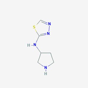 molecular formula C6H10N4S B1466830 N-(pyrrolidin-3-yl)-1,3,4-thiadiazol-2-amine CAS No. 1186300-15-1