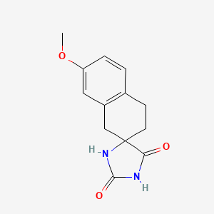 molecular formula C13H14N2O3 B14685283 3',4'-Dihydro-7'-methoxyspiro(imidazolidine-4,2'(1'H)-naphthalene)-2,5-dione CAS No. 35485-63-3