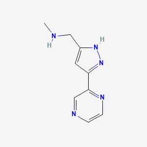 molecular formula C9H11N5 B1469155 N-methyl-1-(3-(pyrazin-2-yl)-1H-pyrazol-5-yl)methanamine CAS No. 1347137-05-6