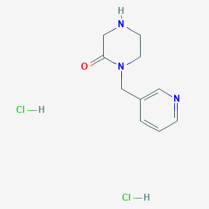 molecular formula C10H15Cl2N3O B1469364 1-[(Pyridin-3-yl)methyl]piperazin-2-one dihydrochloride CAS No. 1067660-28-9
