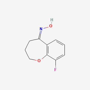 molecular formula C10H10FNO2 B1470146 N-(9-fluoro-2,3,4,5-tetrahydro-1-benzoxepin-5-ylidene)hydroxylamine CAS No. 1432684-04-2