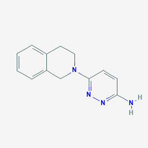 molecular formula C13H14N4 B1472268 6-(1,2,3,4-Tetrahydroisoquinolin-2-yl)pyridazin-3-amine CAS No. 1529685-10-6